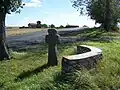 Stone cross and windmill near Aschara