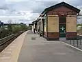 The station platform and building.