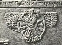 A Neo-Assyrian relief of Ashur as a feather robed archer holding a bow instead of a ring (9th-8th century BC)