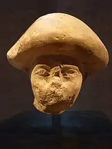 An official wearing the "mushroom-headed" hairstyle also seen in contemporary paintings of Western Asiatic foreigners such as in the tomb of Khnumhotep II, at Beni Hasan. Excavated in Avaris, the Hyksos capital. Staatliche Sammlung für Ägyptische Kunst.