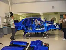 A 2006 Subaru Impreza WRC bodyshell with integrated roll cage