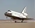 Atlantis touches down at the lakebed runway at Edwards Air Force Base. Wrong picture/mission. Atlantis 61B landed on concrete runway 22.