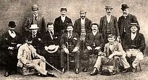 The Australian team pictured during the summer of 1894–95.  Albert is seated at the front, on the right; his older brother Harry Trott is at the far left of the middle row.