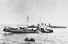 a black and white photograph of a damaged ship