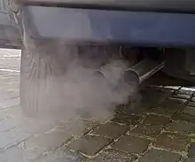 close-up of 2 exhaust pipes with whitish smoke (from Car)