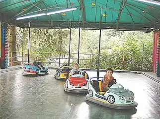 Bumper cars at Taunus Wunderland [de] showing collector poles.