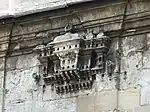 One of the stone-carved birdhouses attached to the outside of the mosque