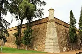 Corner curtain wall, bartizan and spillways in low area