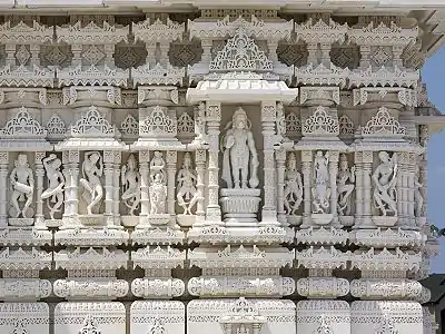 Exterior carvings surrounding the mandir