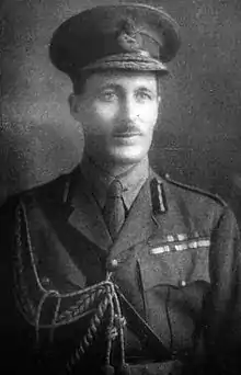 Head and shoulders portrait of a man in military uniform and regalia