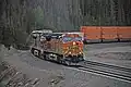 An eastbound BNSF intermodal train cresting the summit of the pass