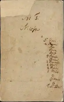 front page of the autograph of the first book, listing the title, the scoring and the abbreviated name of the composer on pale paper