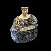 Female figurine of the "Bactrian princess" type; between 3rd millennium and 2nd millennium BC; chlorite mineral group (dress and headdresses) and limestone (face and neck); height: 17.3 cm, width: 16.1 cm; Louvre