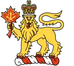 The crest of the King of Canada (and badge of the office of the Governor General of Canada), a crowned lion holding a maple leaf atop a torse.