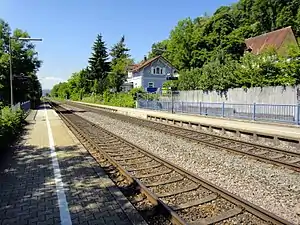 Double-tracked railway line with side platforms