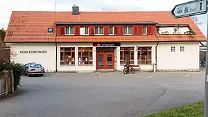 White building with red tiled roof