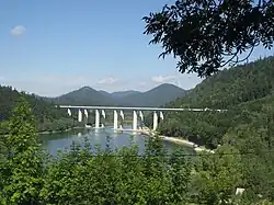 Concrete motorway bridge spanning lake