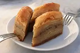 Baklava, a pastry comprising layers of filo with chopped nuts, sweetened and held together with syrup or honey