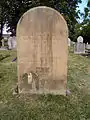 An unusual headstone showing a formerly glazed recess to contain World War I medals