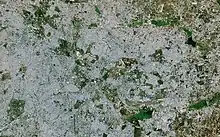 A satellite image from 2018. It is covered with the city area. Big lakes such as Bellandur are visible.