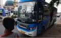 BRT Banjarbakula bus approaching a bus stop