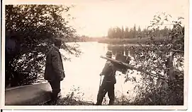 Dr. Karl Clark and guide Romeo Eymundson on the bank of the Athabasca River.