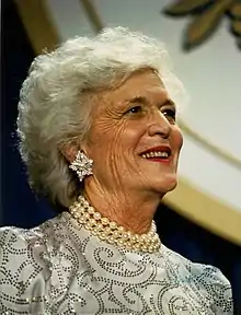 Barbara Bush smiles, looking up and to the right.