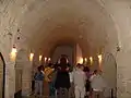 Hallway of sarcophagi full with visitors.