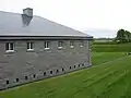 Behind the barracks of Fort Lennox.