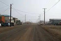 Street view of Utqiagvik in July 2008: This street, like all the others in Utqiagvik, has been left unpaved due to the prevalence of permafrost.