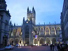 Large floodlight stone building with tower