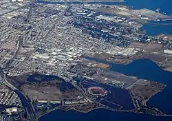 A bird's-eye view of the Bayview–Hunters Point neighborhood of San Francisco. Candlestick Park, demolished in 2015, is in the foreground