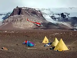 A helicopter prepares to land at Beacon Valley camp.