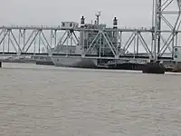 View from Riverfront Park of ship at one of the Port of Beaumont wharves