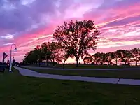 A sunset during the summer, as seen from Water Plant Road.