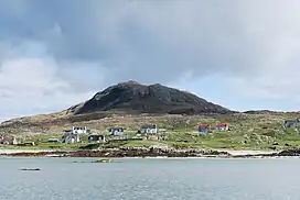 Image 28A scattered settlement on Eriskay in the Outer Hebrides, beneath Beinn SciathanCredit: Mipmapped