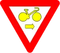 B22: Bike may pass a yellow or red light to turn right, after yield