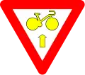 B23: Bike may pass a yellow or red light to go straight, after yield