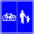 F99b: Start of a road or part of a road reserved for pedestrians, cyclists horse riders and drivers of speed pedelecs with segregation