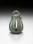 Western Iran, circa 1000-650 B.C. Bronze bell, 2 5/8 x 1 5/8 inches.