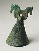 Western Iran, circa 150 B.C. - 224 A.D. Hammered bronze bell, 1.5 inches tall. Bell hung on horse tack or bridle?