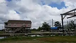 Raised houses of the community along the Reggio Canal.