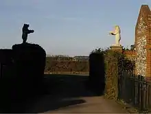 Statues of two bears at the entrance to Bentworth Hall