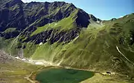 The Bergersee Hut ({{Subst:Formatnum:2181}} m) (below the Goldeckscharte notch), seen from the ascent to the Berger Kogel (1980)