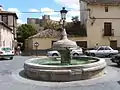 Fountain in Berlanga with Berlanga Castle in the background