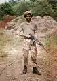 A Bermuda Regiment NCO in No. 5 (Desert Combat) Dress, armed with a Galil AR self-loading rifle at USMC Camp Lejeune in 1994.