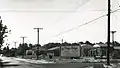 Old Harford Road at King's Ridge Road, Parkville, Baltimore County, MD, looking south, showing partial widening of Old Harford Road during construction of King's Ridge subdivision; Sep. 1956