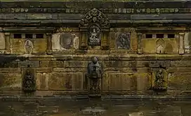 Two jahru's on either side of the stone spout at Bhandarkhal Pokhari in Patan