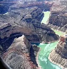 Aerial view of river winding through a steep canyon