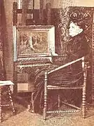 Maria van Bosse in her studio c. 1900, with a finished 'Forest-view' on the easel